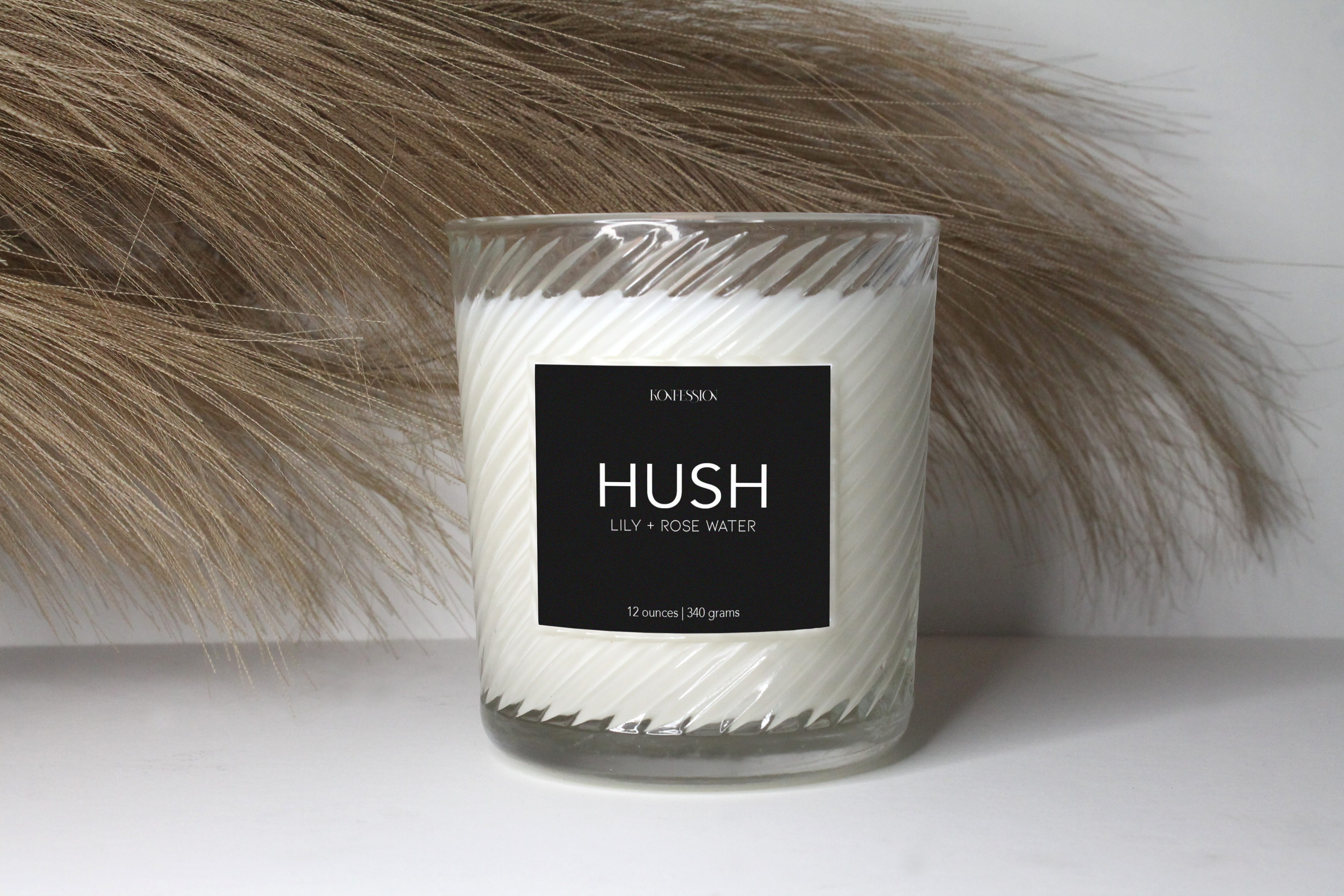 Our candles are made with 100% natural soy wax. The candle is a clear rigged class with a black lable and white writing. 