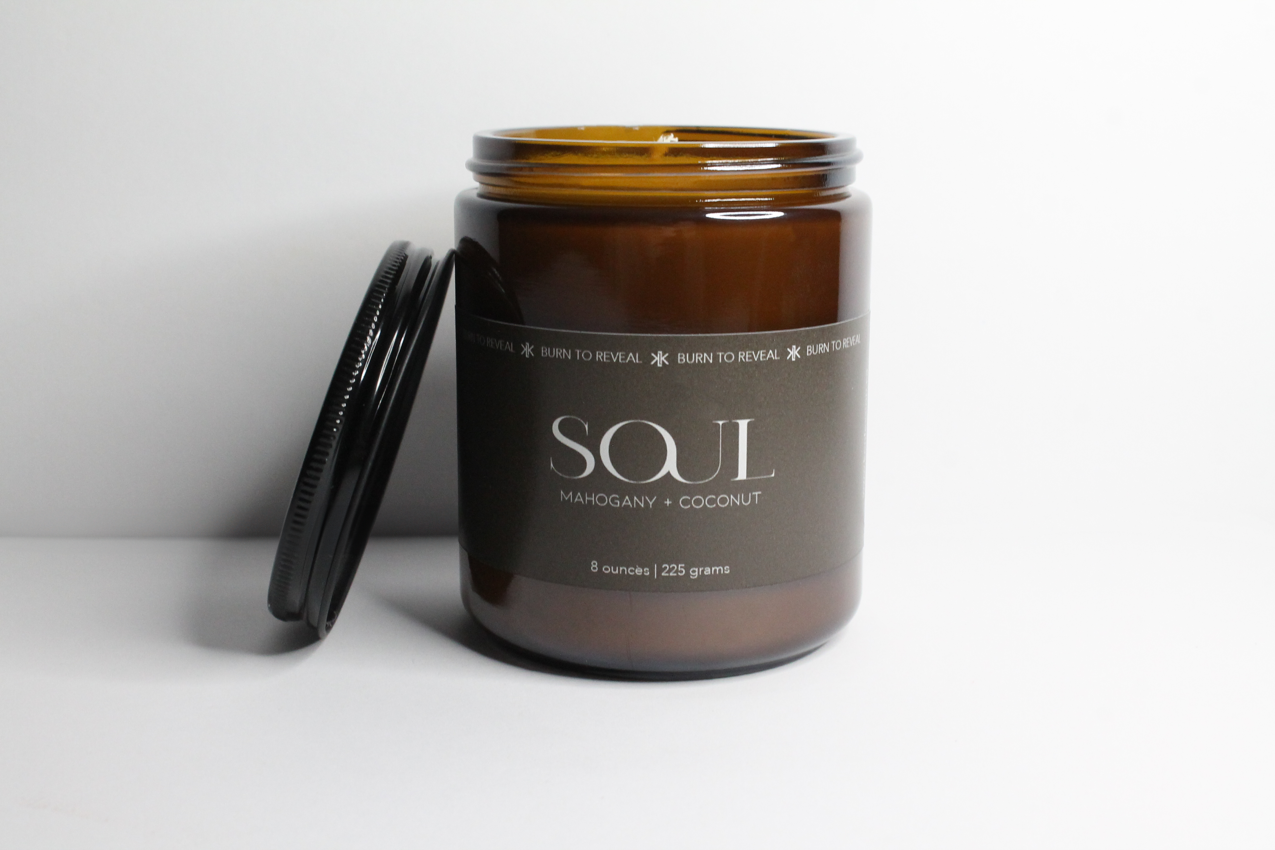 8 ounce soy candle in the scent of mahogany and coconut. Burn to reveal candle that connects you with strangers from around the world.