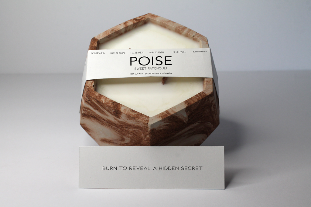 Poise candle in the scent of sweet patchouli. 