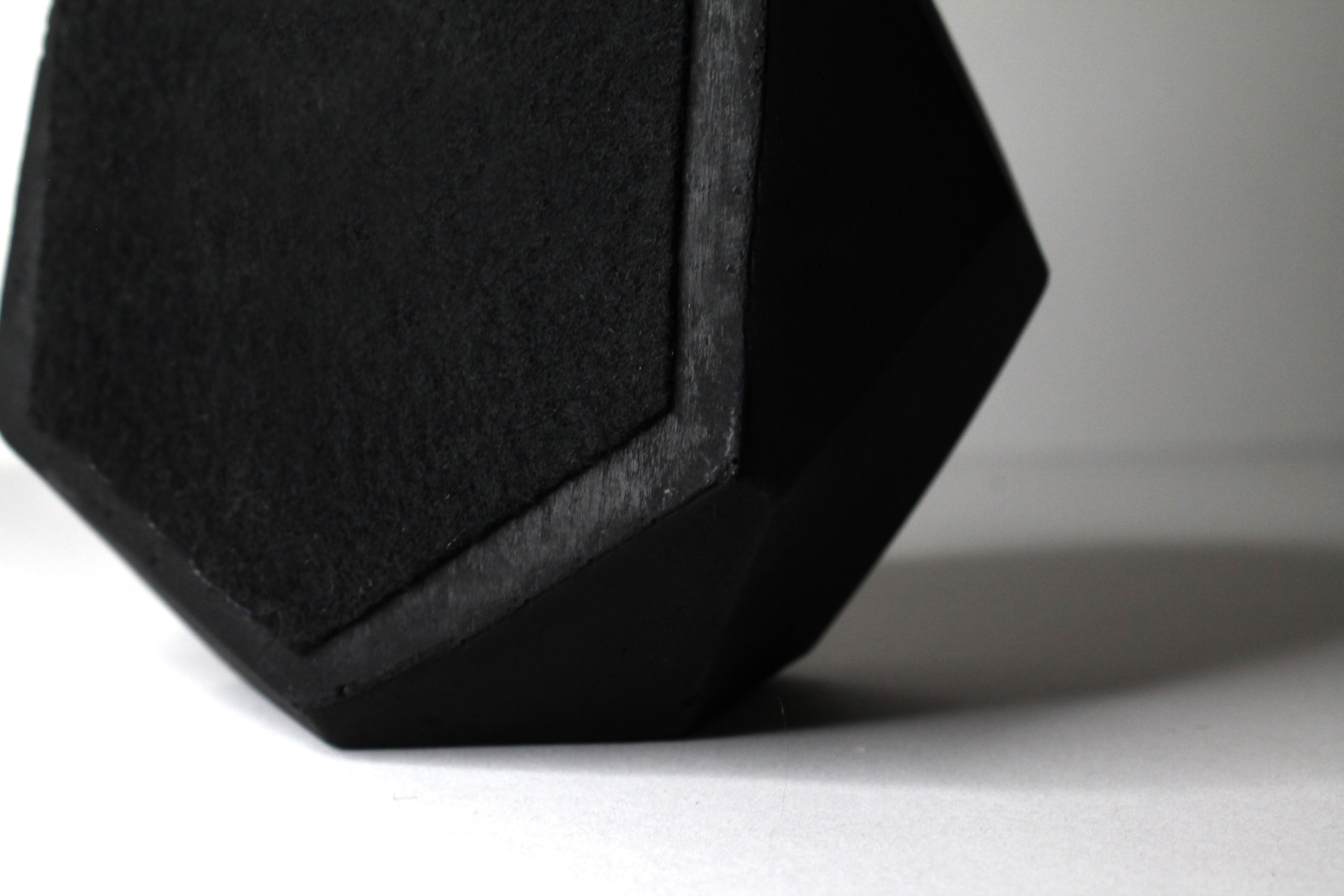 Black concrete candle with a felt bottom to protect your home.