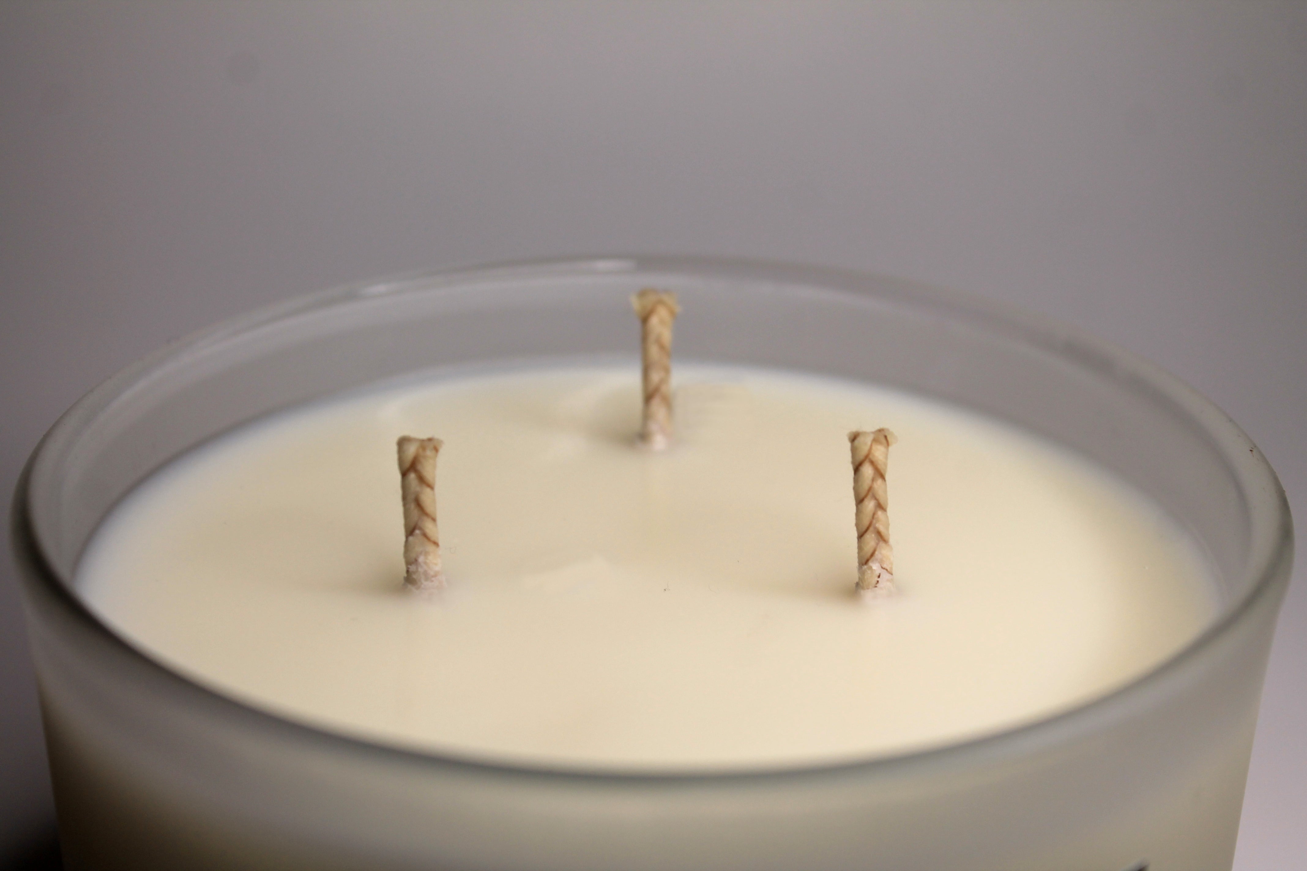 Our 15 ounce candles are made with 3 cotton wicks. 